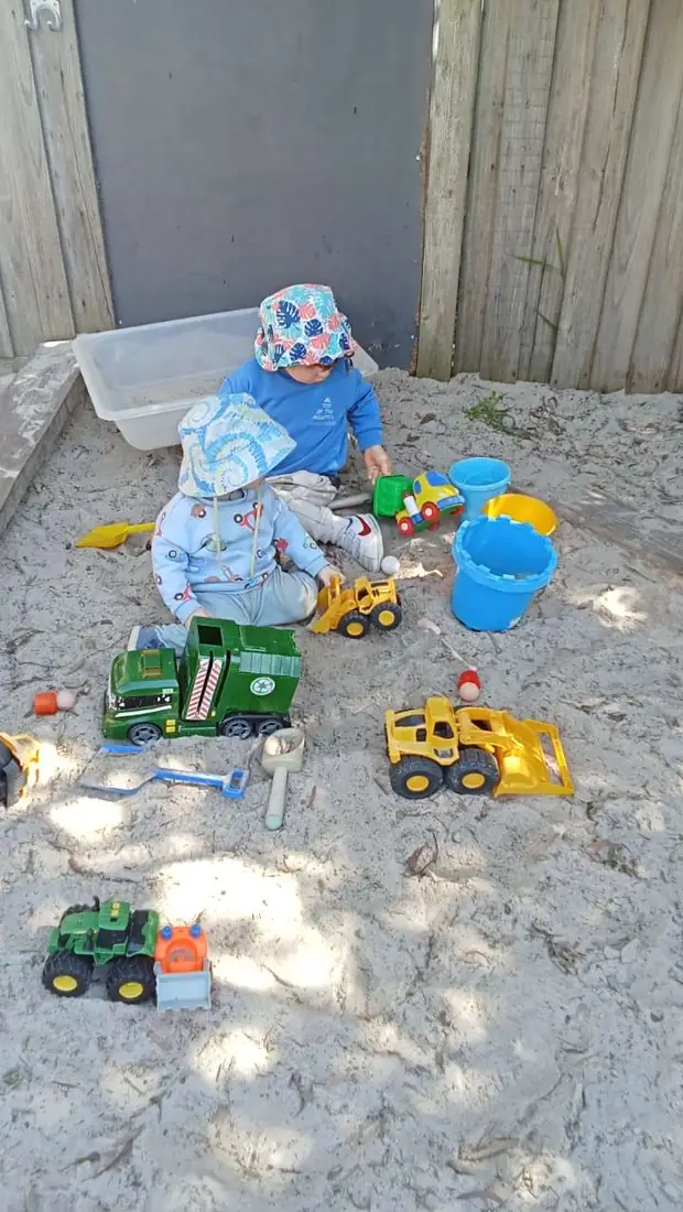 Toddlers playing in the sandpit at Kindoo